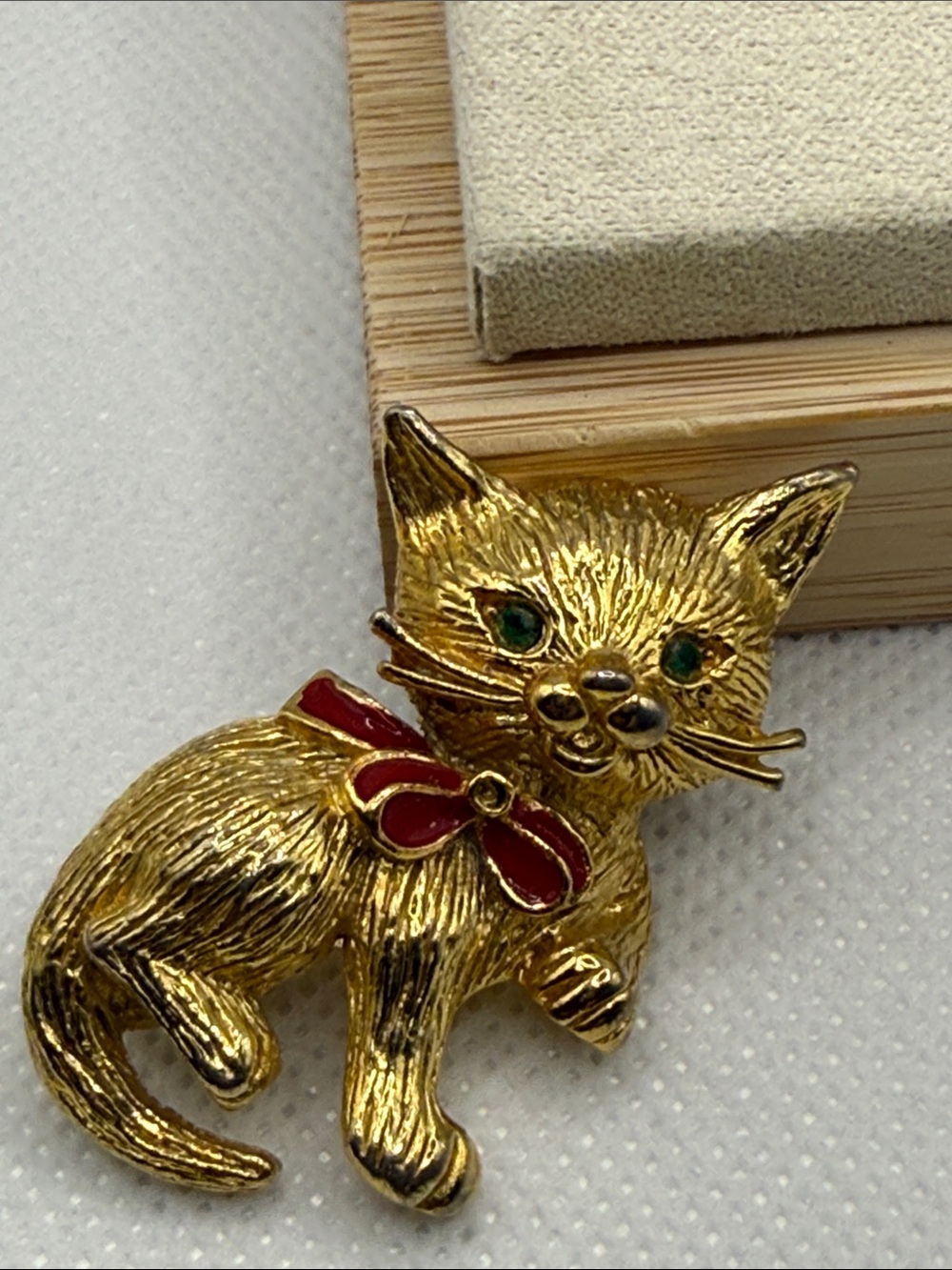 Vintage Gold-Tone Cat Brooch with Red Bow and Green Eyes signed